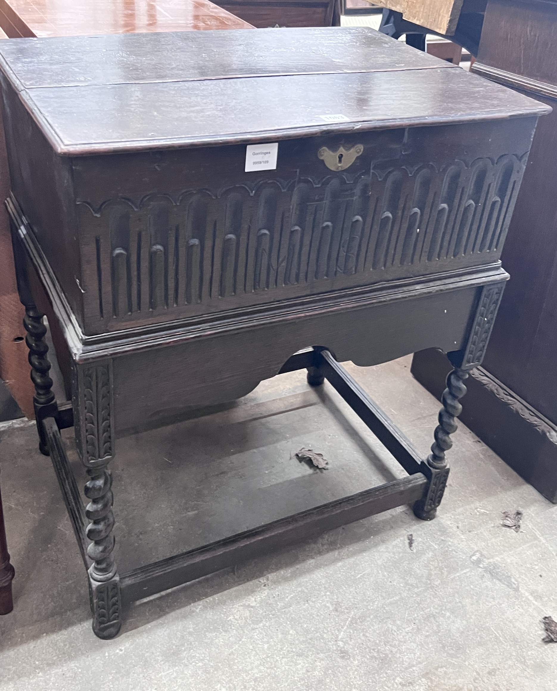 A 17th century style oak bible box on associated stand, width 68cm, depth 49cm, height 80cm